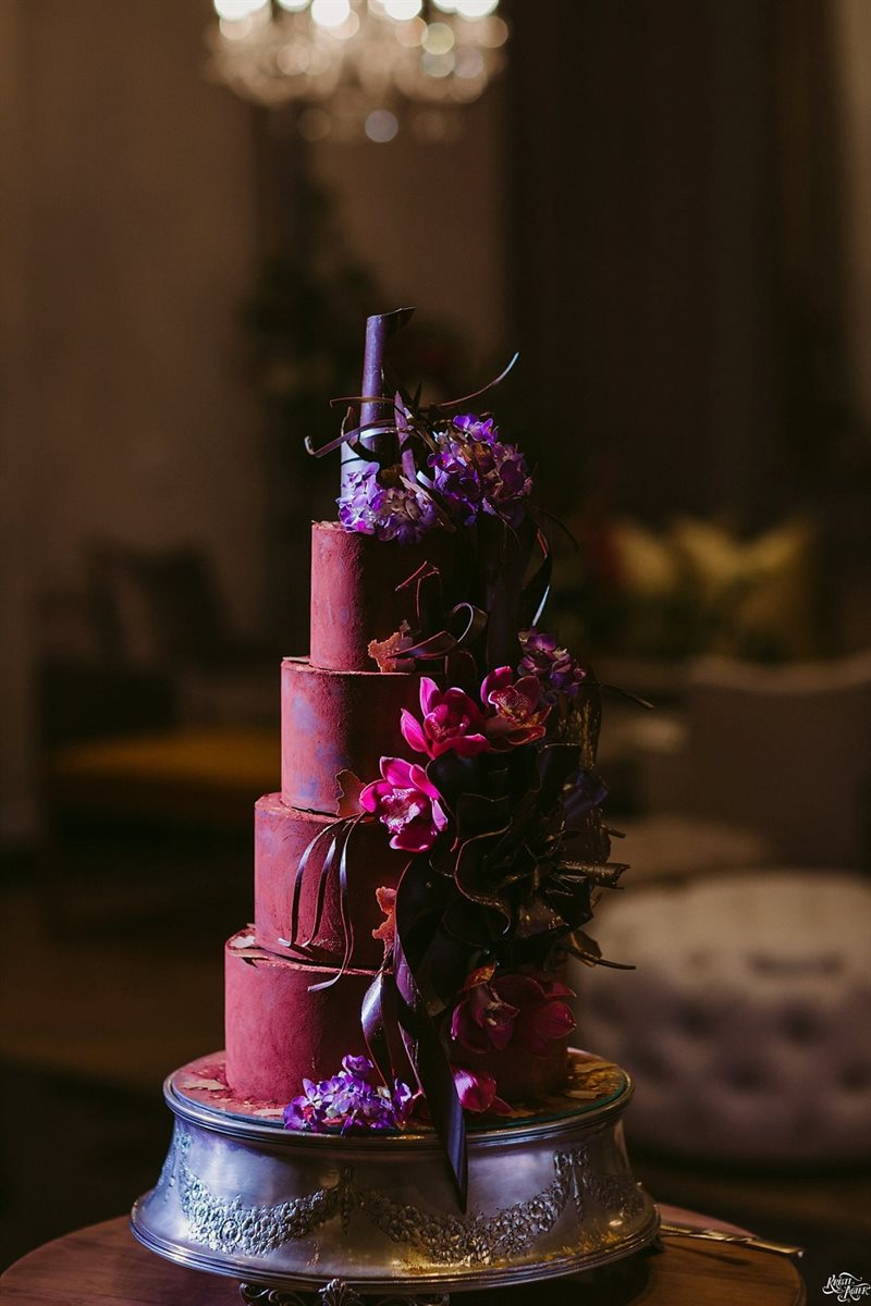 Cocoa-dusted chocolate cake with sculpted flower and tendrils